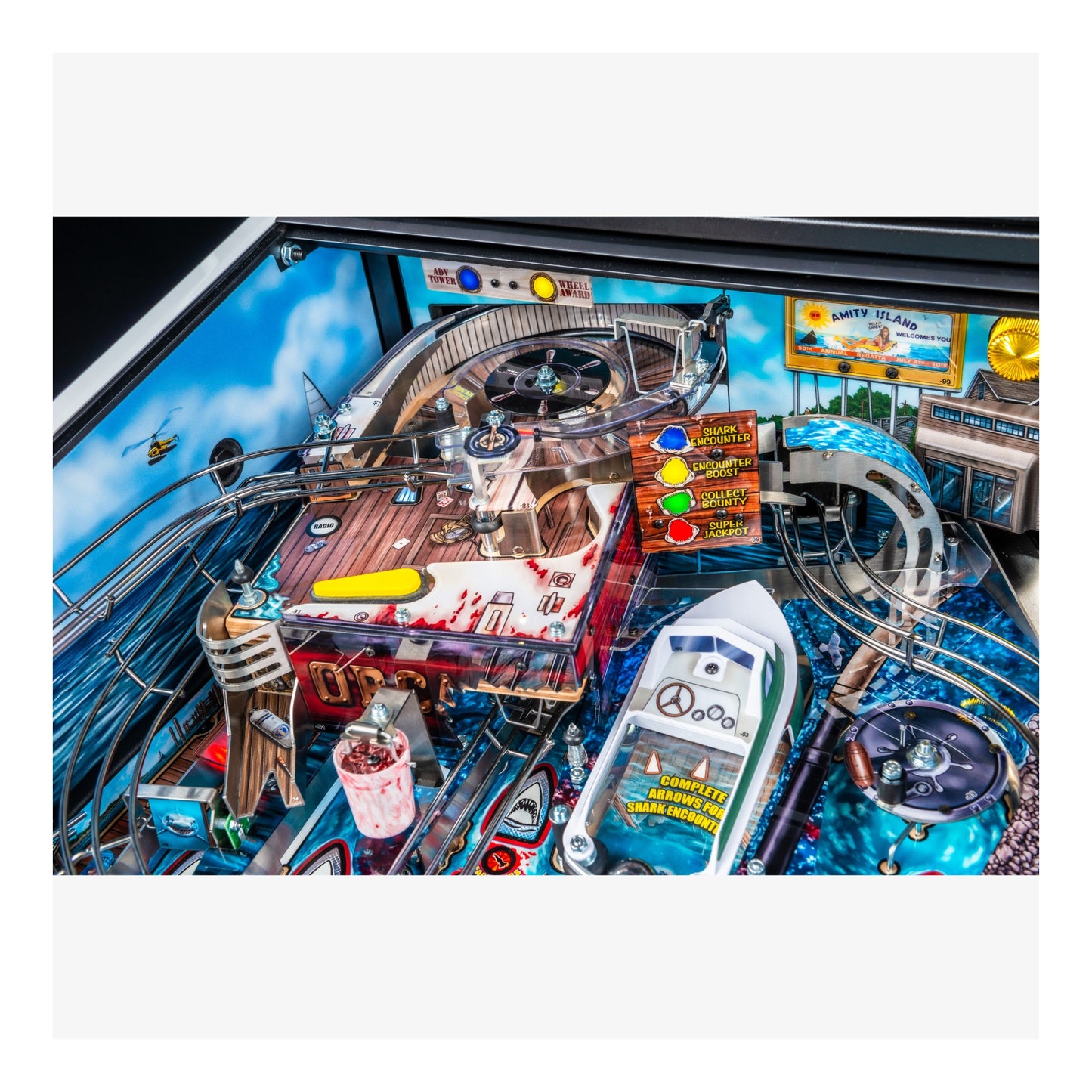 Close-up of a pinball machine with various components and a colorful background.