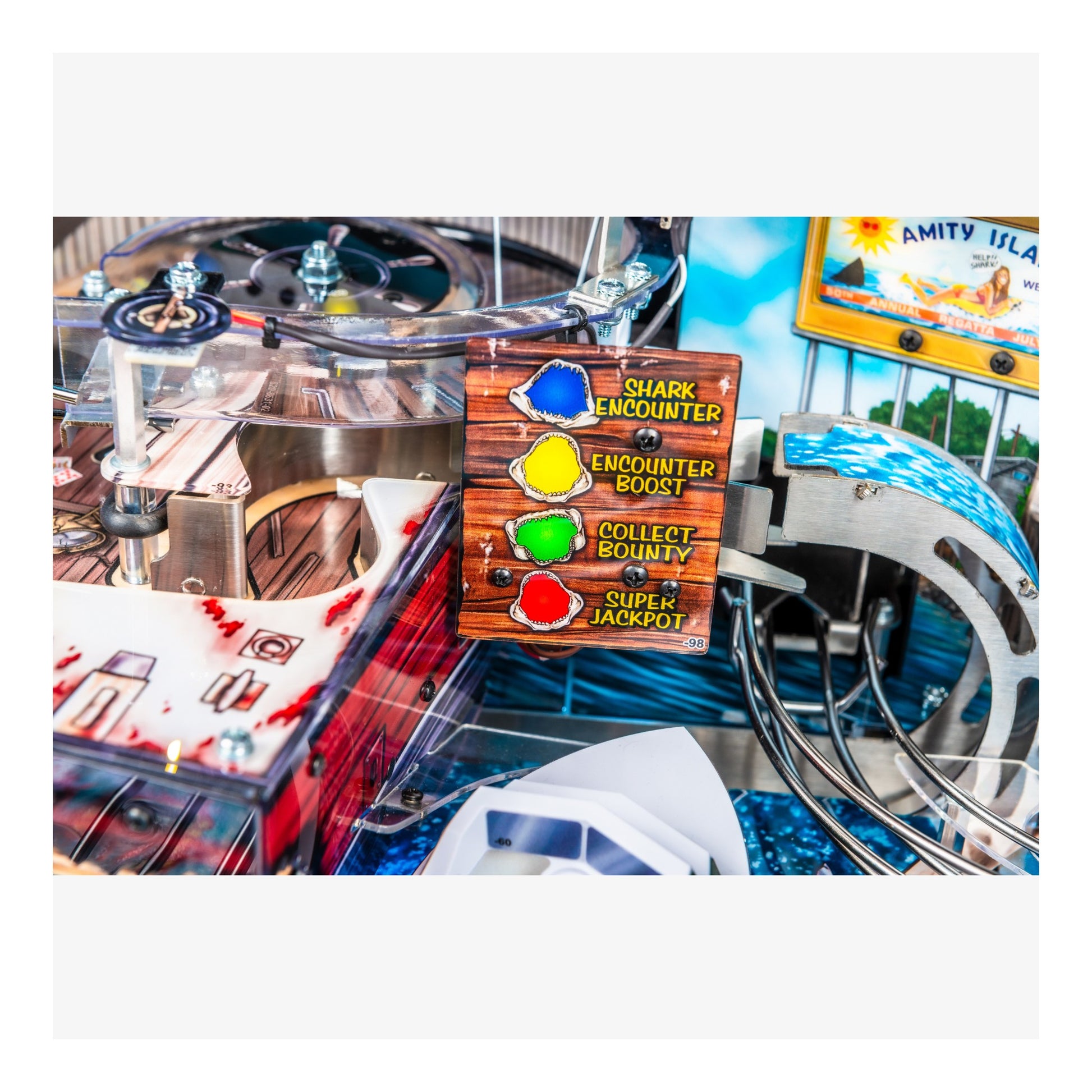 Close-up of a pinball machine with a control panel displaying various game functions.