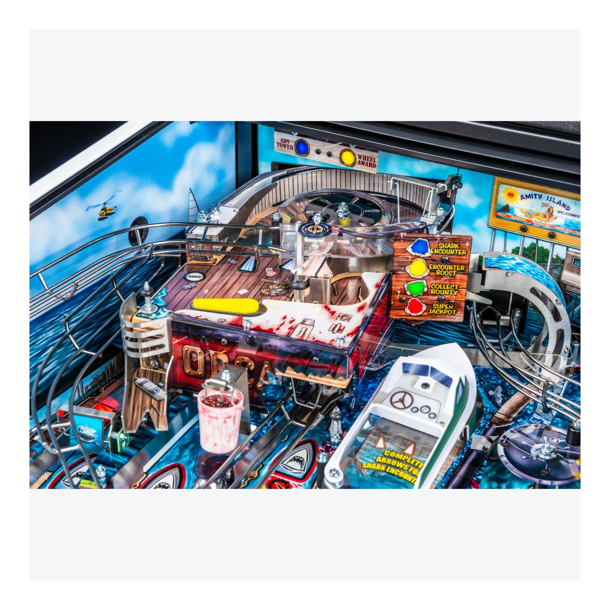 Close-up of a pinball machine with various components and a colorful layout.