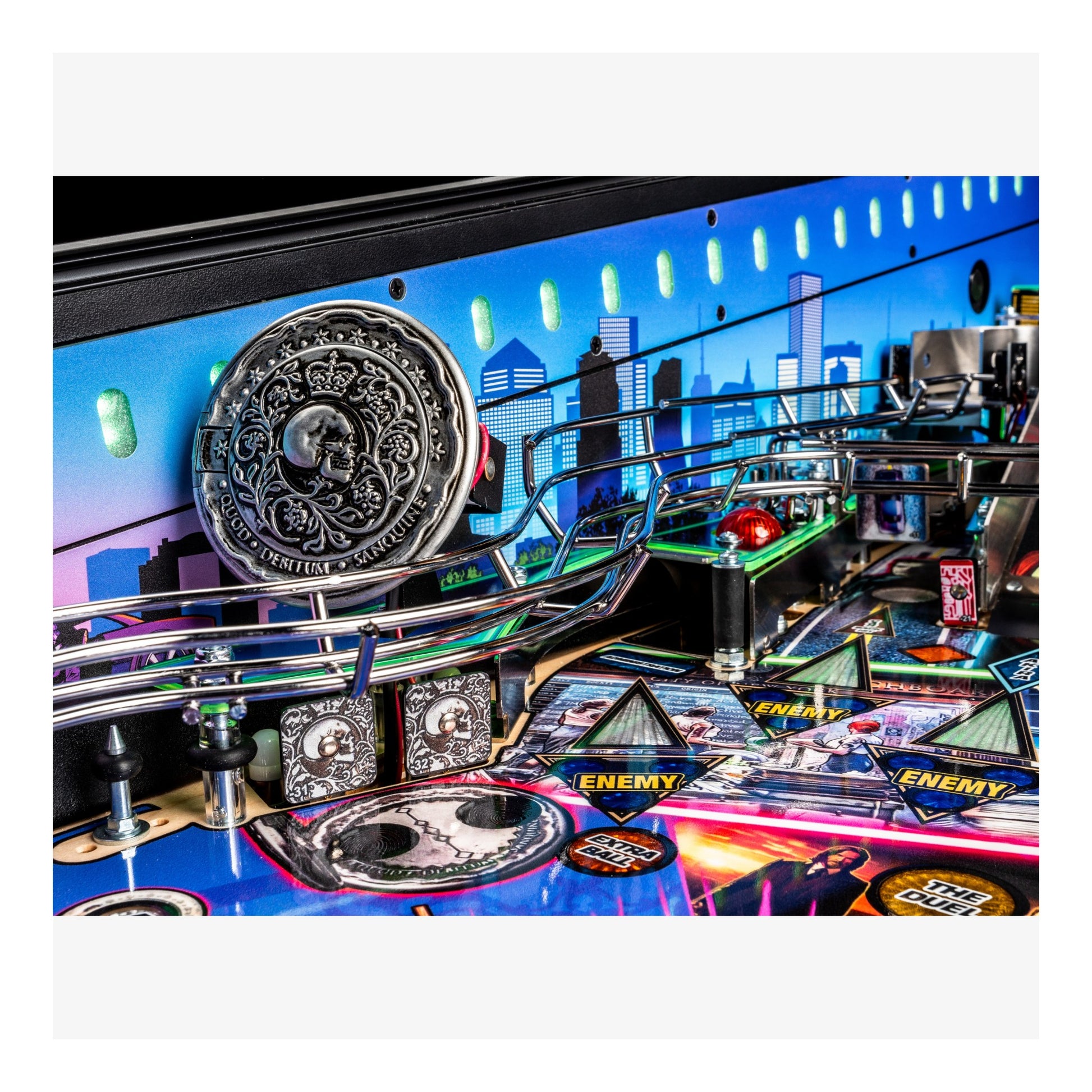 Close-up of a pinball machine with colorful design and lights.