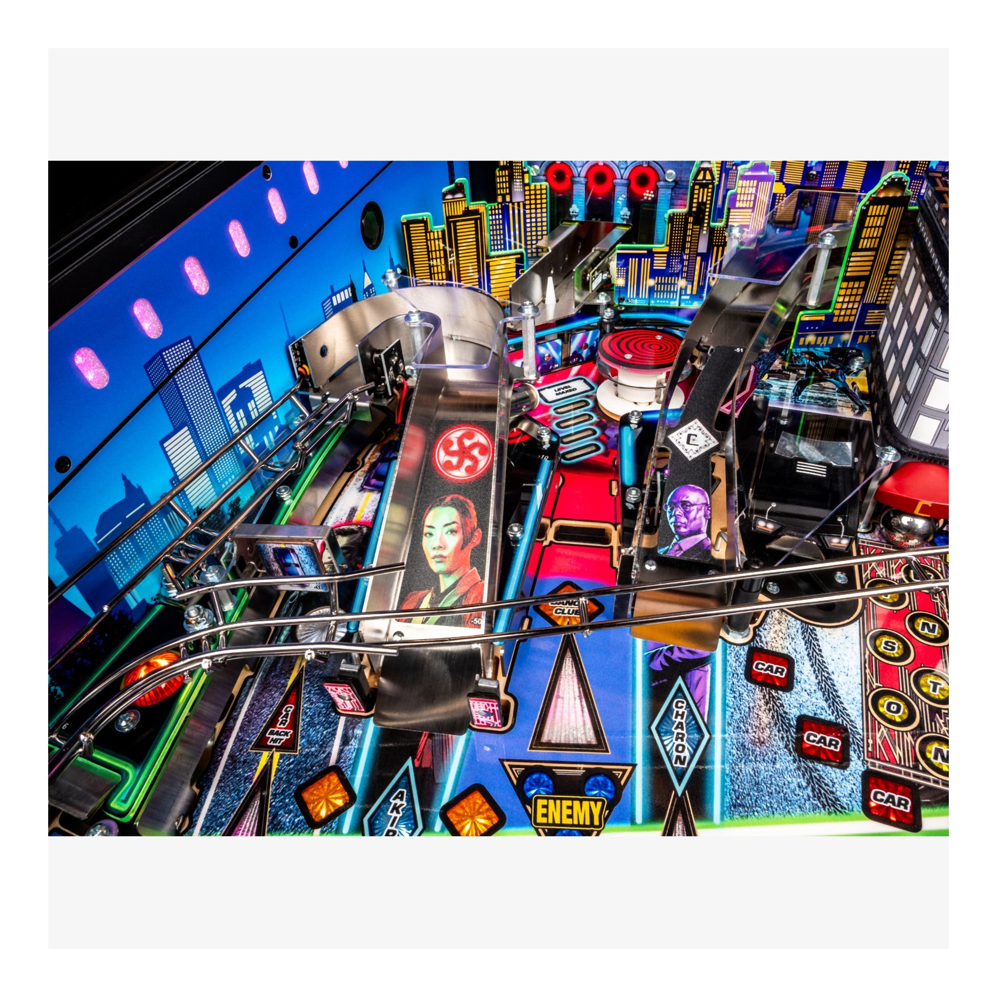 Close-up of a colorful pinball machine with vibrant lights and detailed design.