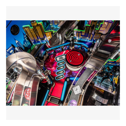 Close-up of a colorful pinball machine with vibrant lights and mechanical components.