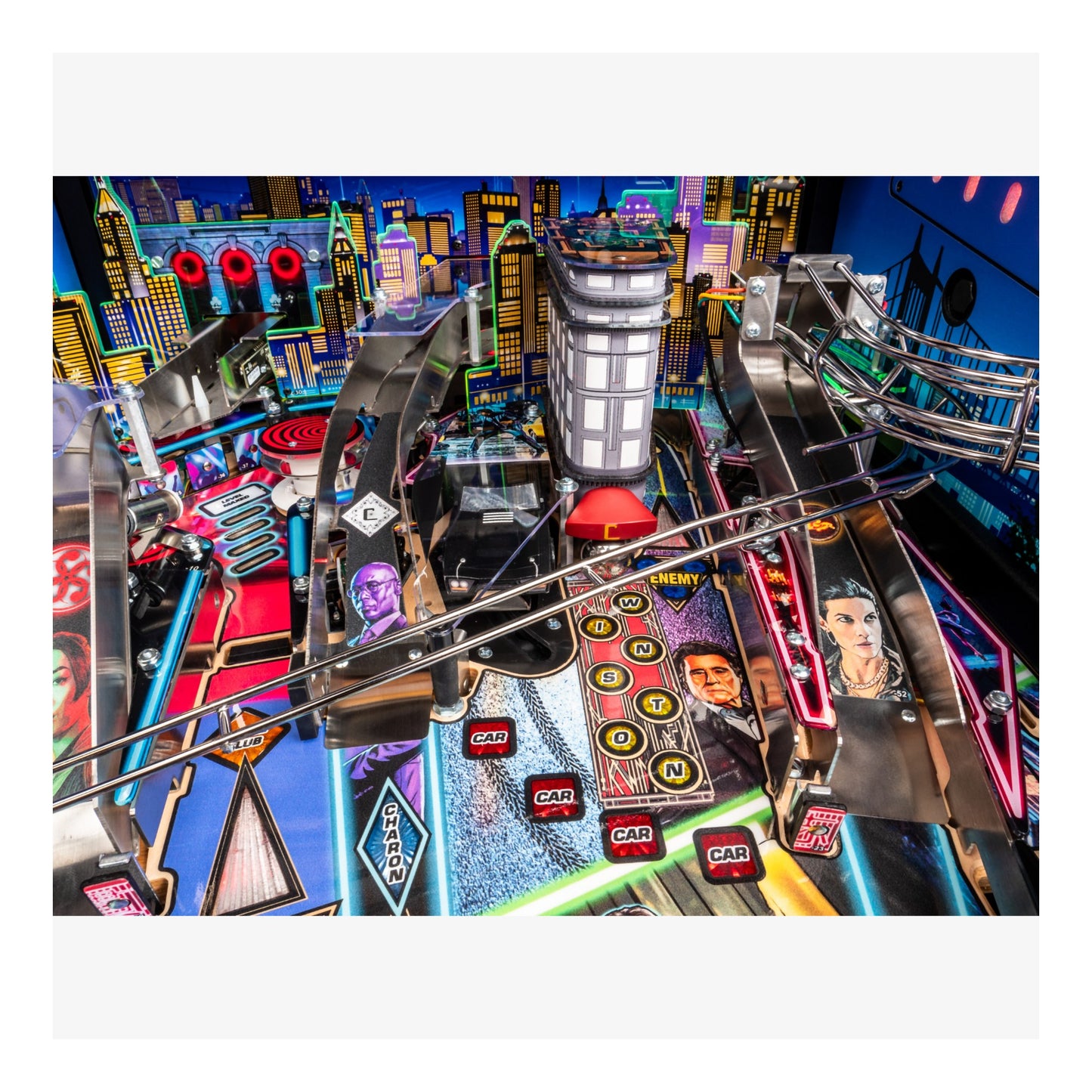 Colorful pinball machine with various symbols and characters on a vibrant background