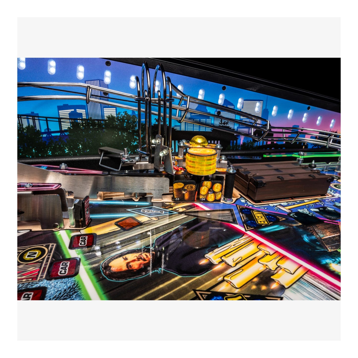 Colorful pinball machine with various game elements and a cityscape background