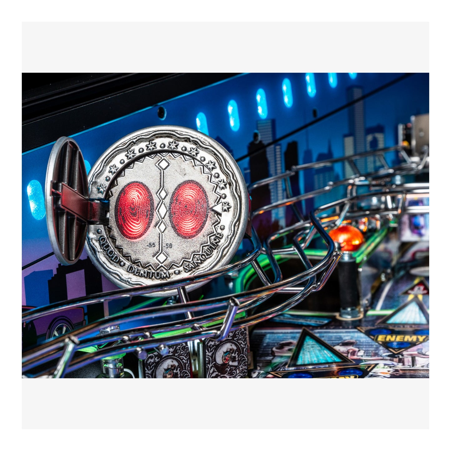 Close-up of a pinball machine with a detailed playfield and vibrant lighting.