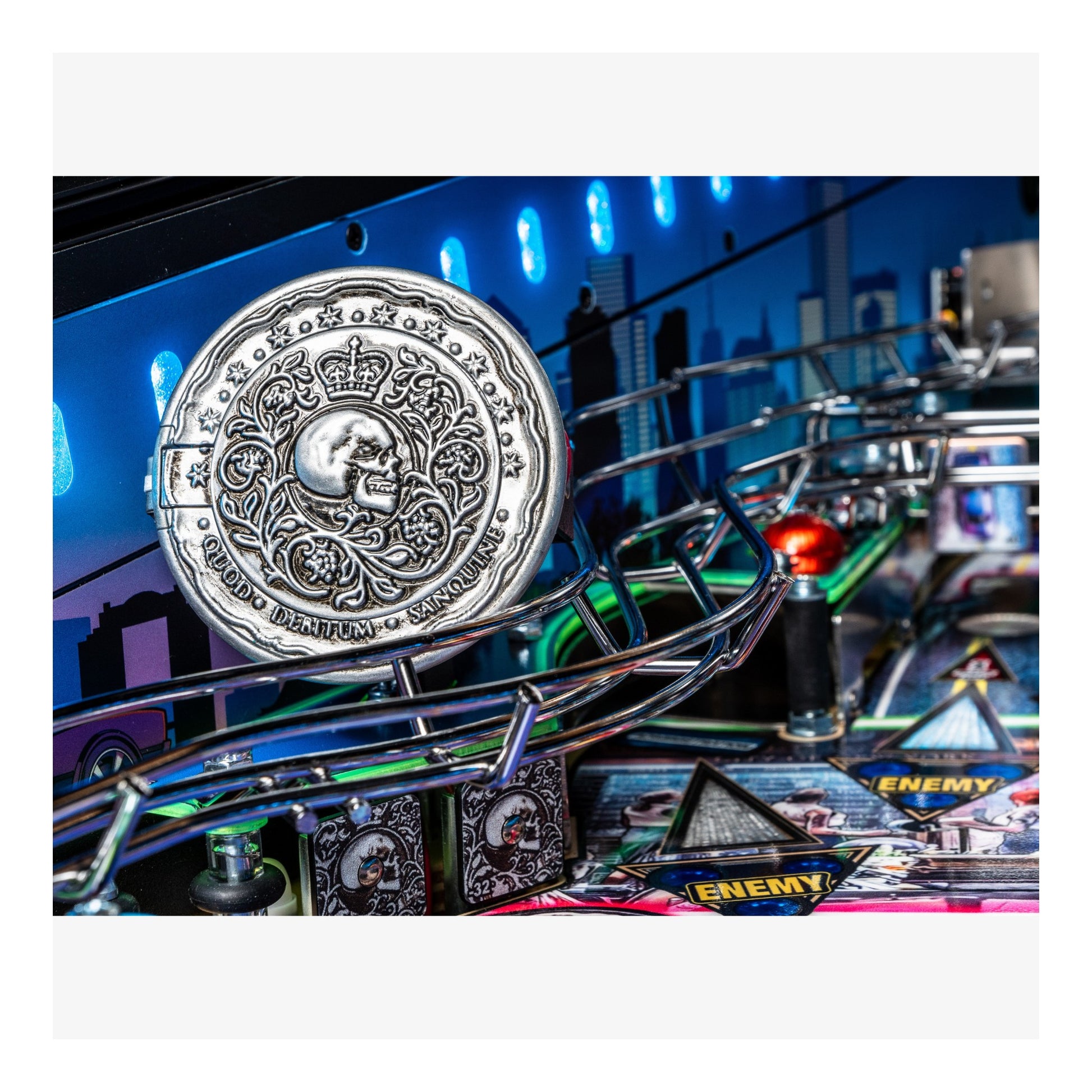 Decorative coin on a pinball machine with colorful lights and playfield.