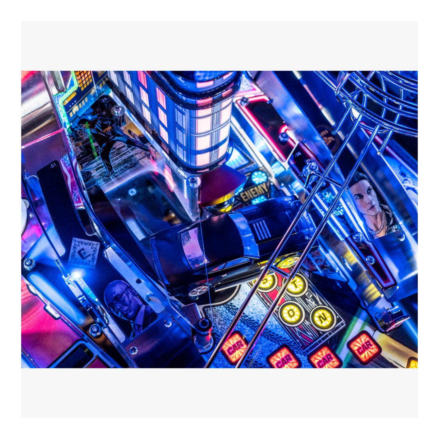 Close-up of a colorful arcade machine with neon lights