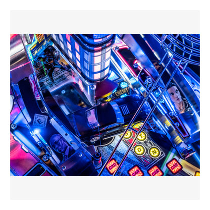Close-up of a colorful arcade machine with neon lights