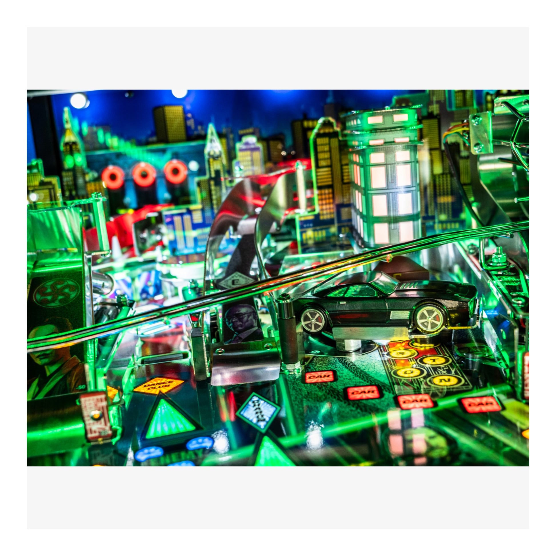 Close-up of a pinball machine with vibrant colors and detailed design.