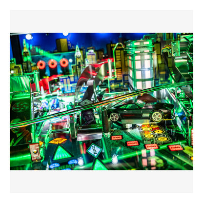 Close-up of a pinball machine with vibrant colors and detailed design.