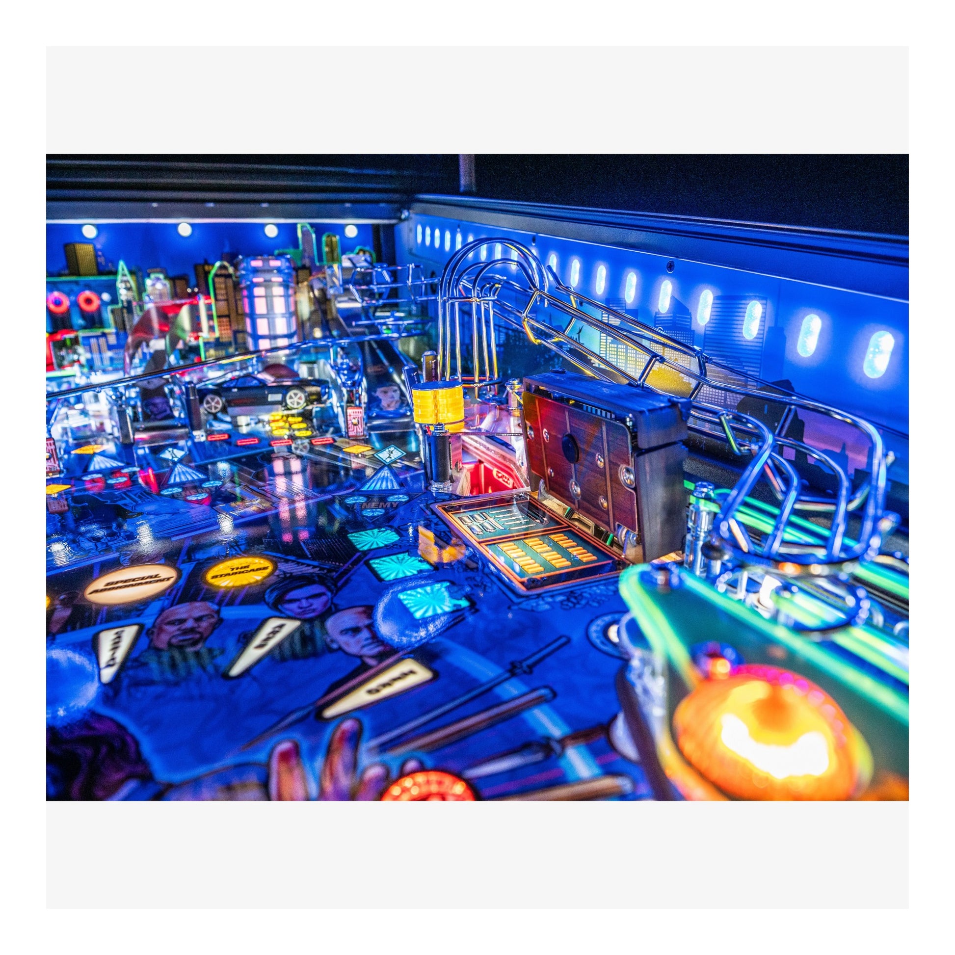 Colorful pinball machine with vibrant lights in an indoor setting