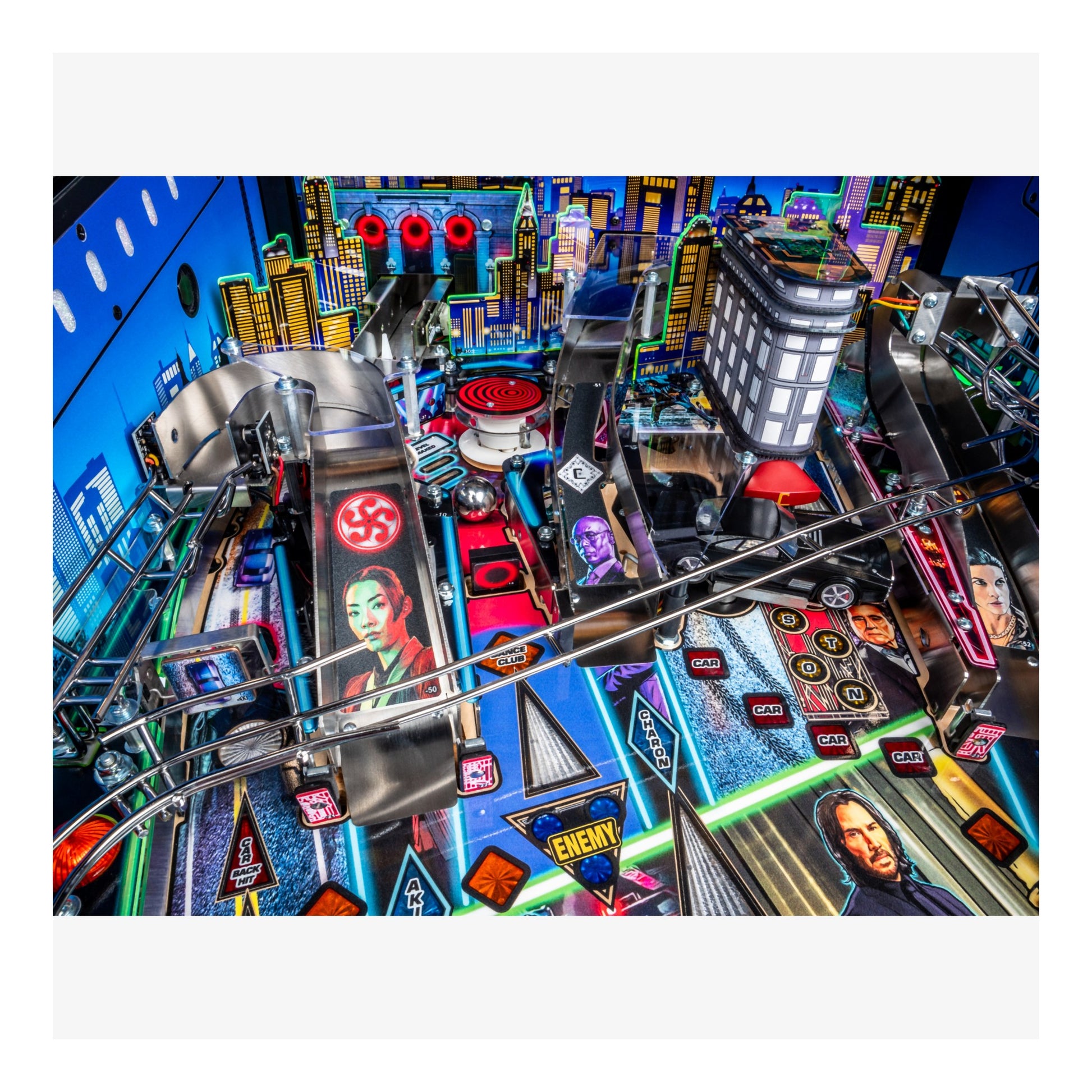 Colorful pinball machine with various symbols and characters on a white background