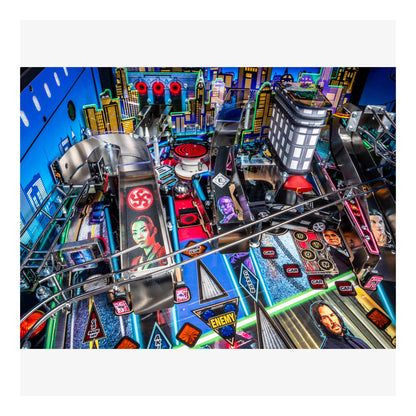 Colorful pinball machine with various symbols and characters on a white background