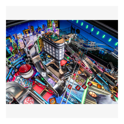 Close-up of a pinball machine with colorful lights and details.