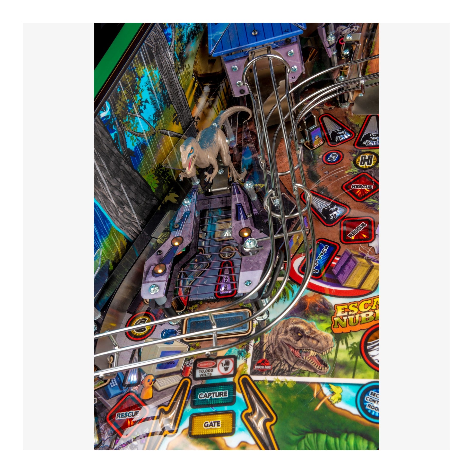 Close-up of a pinball machine with colorful design and various elements.