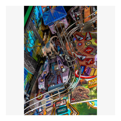 Close-up of a pinball machine with colorful design and various elements.