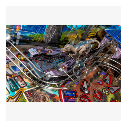 Close-up of a pinball machine with a lizard figure and colorful background