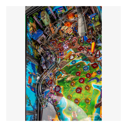Close-up of a colorful pinball machine with various symbols and designs.