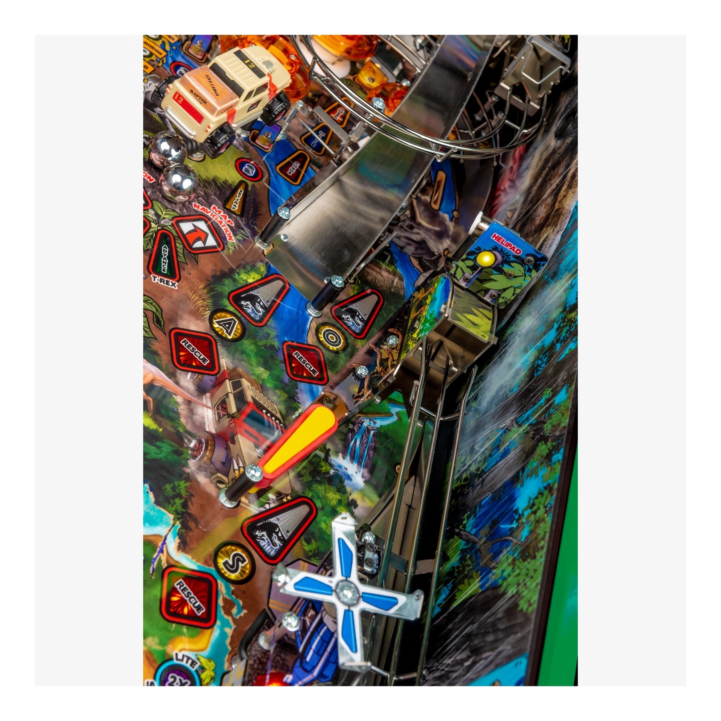 Close-up of a colorful pinball machine with various elements and symbols.