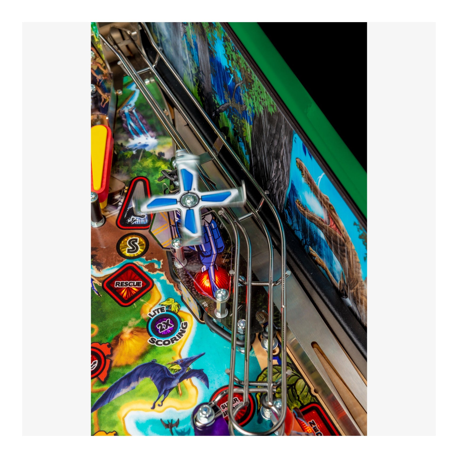 Close-up of a colorful pinball machine with detailed artwork and playfield.