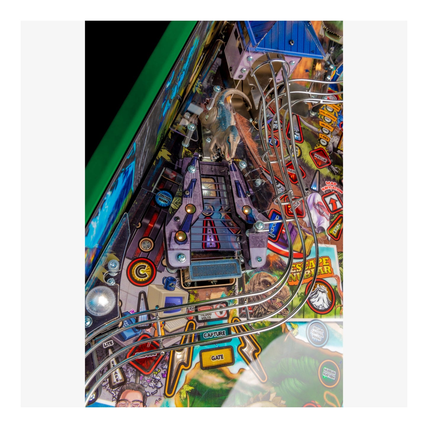 Close-up of a colorful pinball machine with various lights and details.