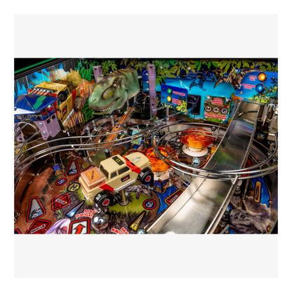 Close-up of a pinball machine with various toys and graphics on a colorful background