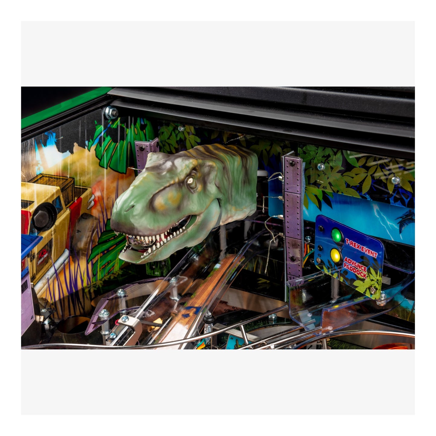 Pinball machine with dinosaur head sculpture and colorful background