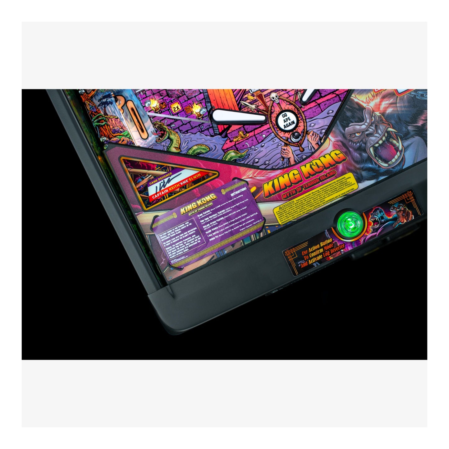 Close-up of a colorful pinball machine with 'King Kong' branding on a white background