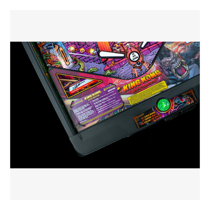 Close-up of a colorful pinball machine with 'King Kong' branding on a white background