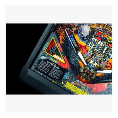 Close-up of a colorful pinball machine with intricate details on a white background