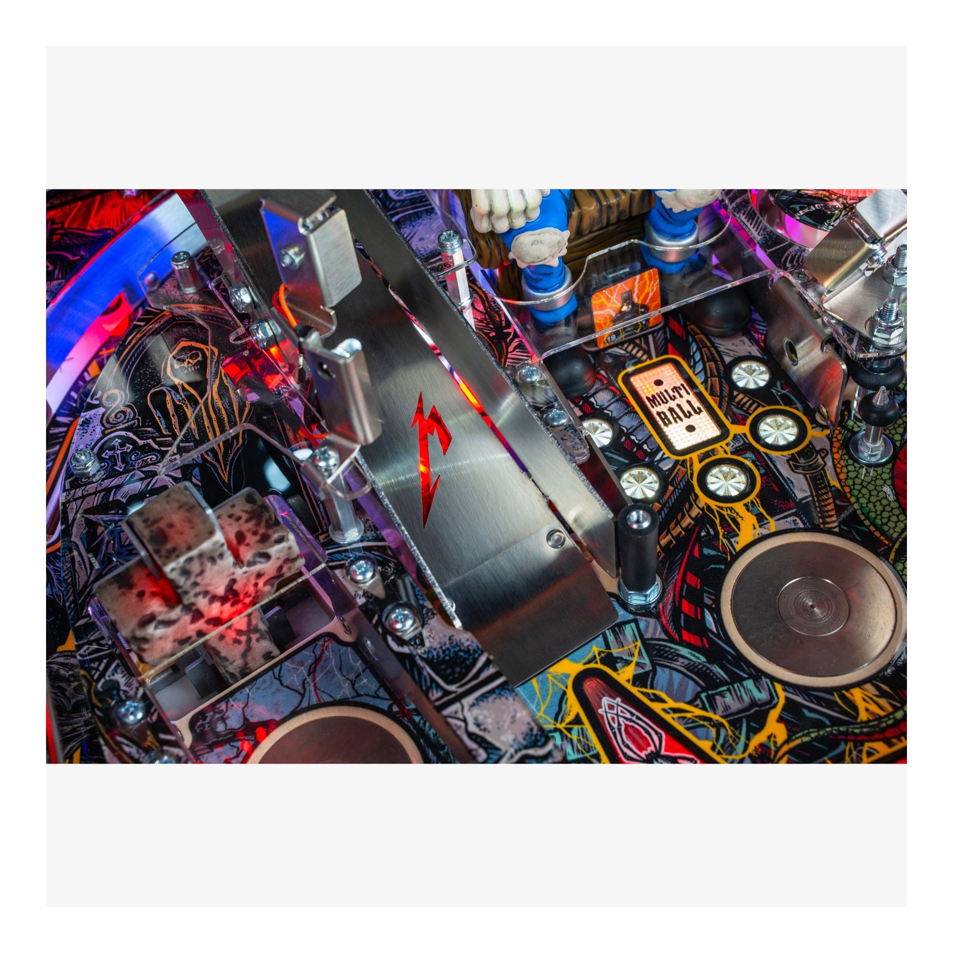 Close-up of a pinball machine with colorful and detailed design