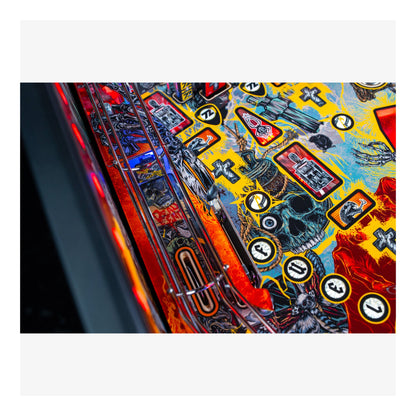 Close-up of a colorful pinball machine with various symbols and designs.