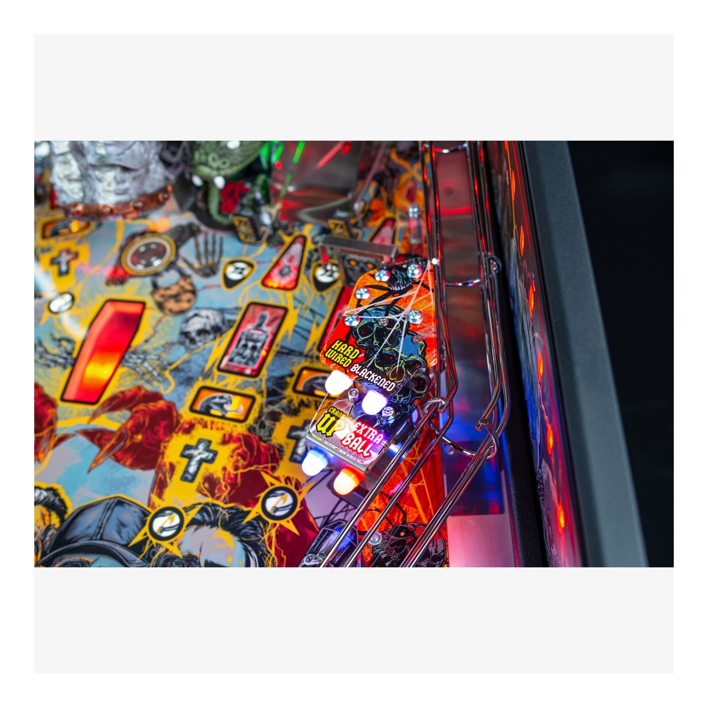Close-up of a colorful pinball machine with vibrant graphics and lights.