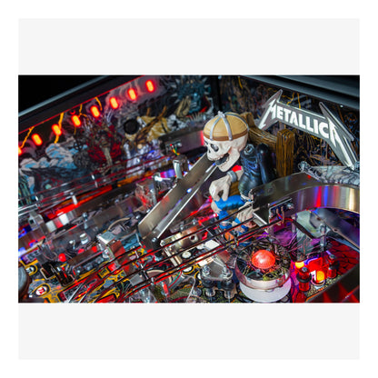 Pinball machine with a skeleton playing guitar and 'Metallica' branding.