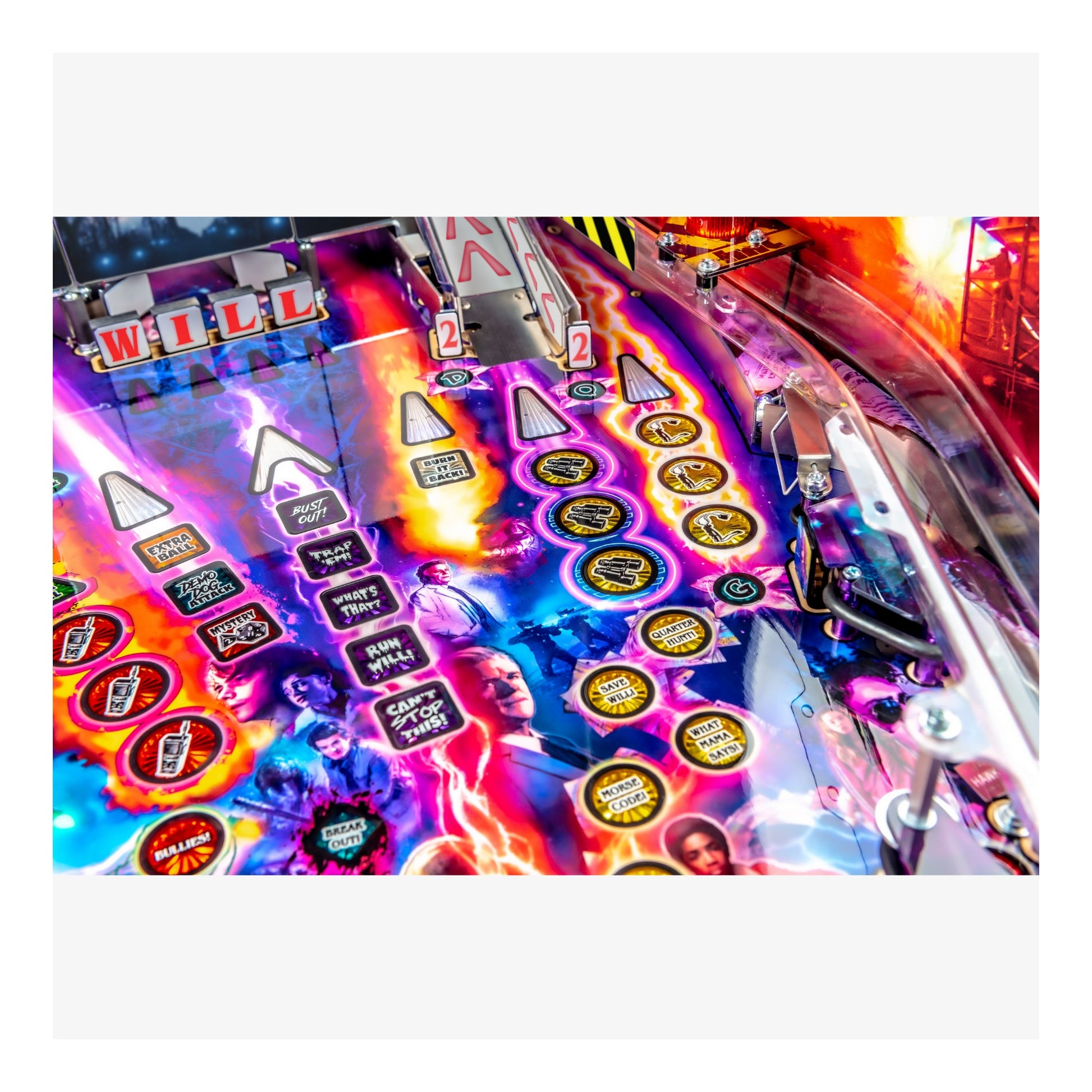 Colorful pinball machine with various symbols and text on a white background