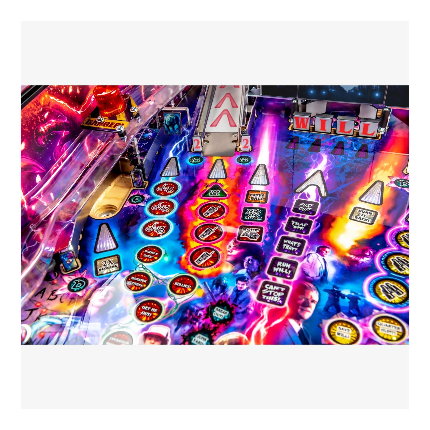 Colorful pinball machine with various symbols and text on a white background