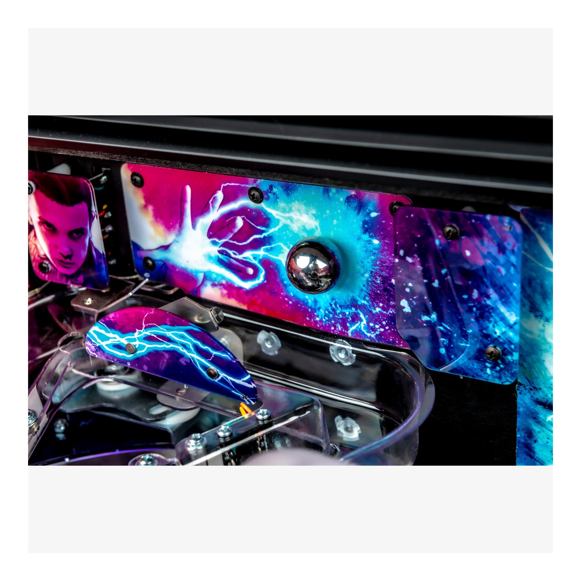 Colorful pinball machine with vibrant graphics on a white background