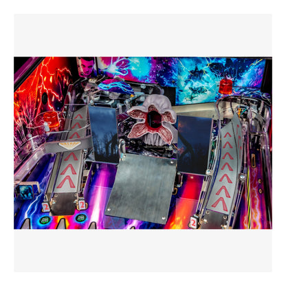 Close-up of a colorful pinball machine with vibrant lights and details.