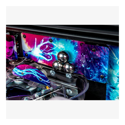 Colorful pinball machine with vibrant design and metallic elements.