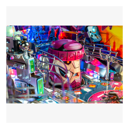 Close-up of a pinball machine with a robot figure on a colorful background