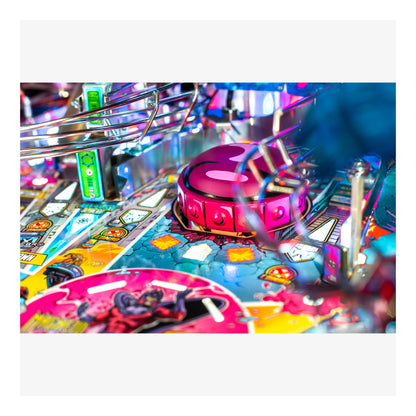 Close-up of a colorful pinball machine with vibrant lights and details.