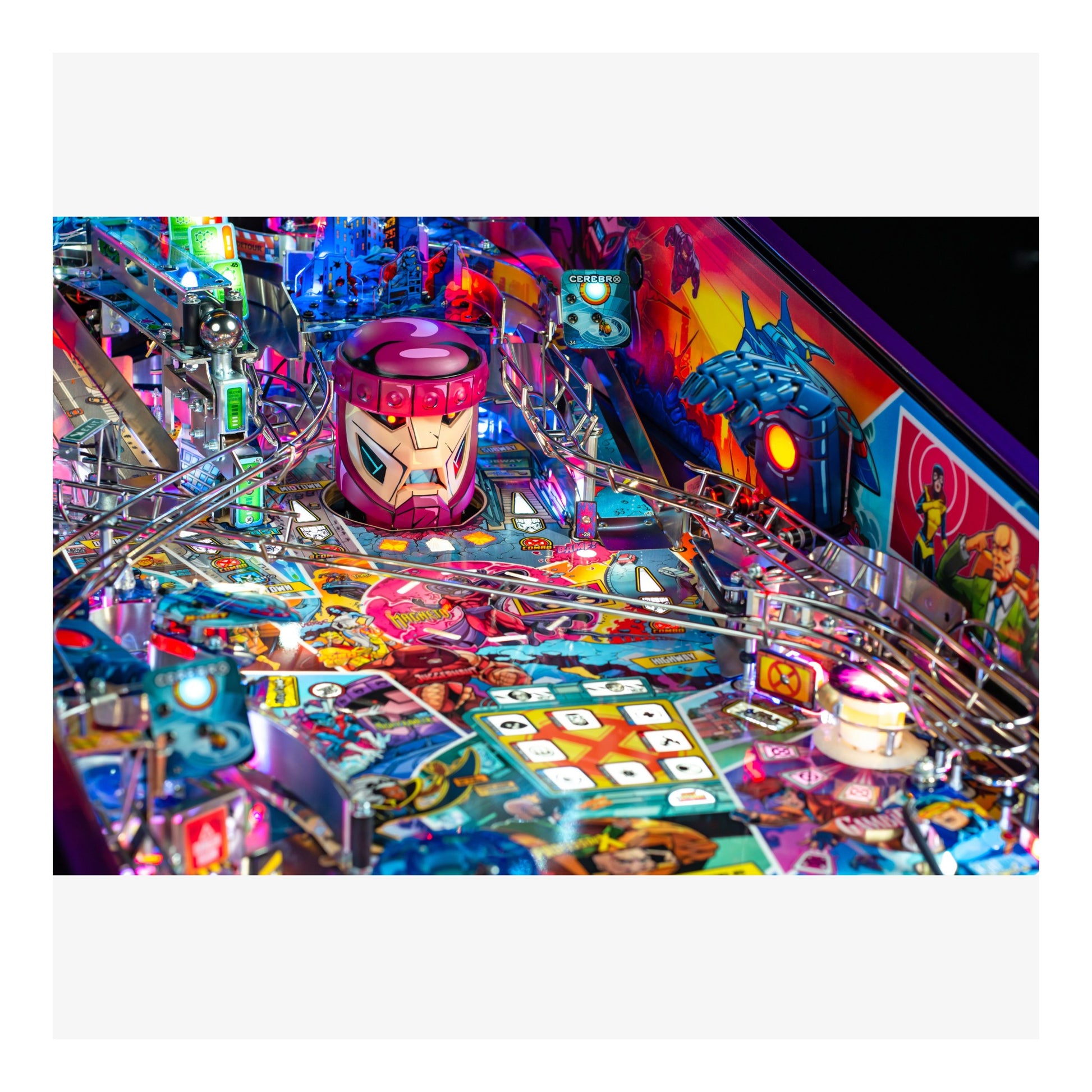 Colorful pinball machine with various elements and a prominent character figure.