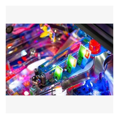 Close-up of a colorful pinball machine with lights and mechanics