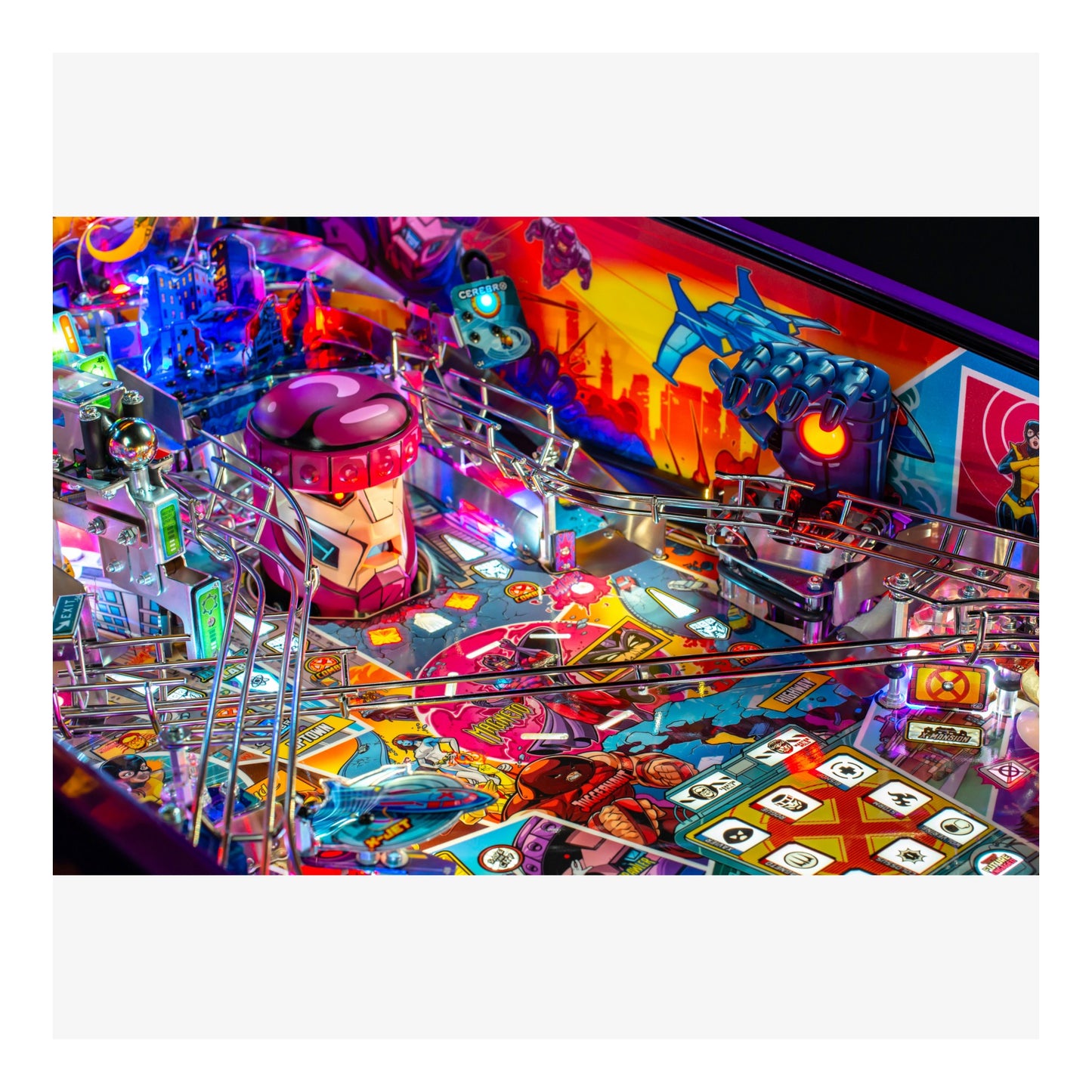 Colorful pinball machine with various elements and lights on a white background