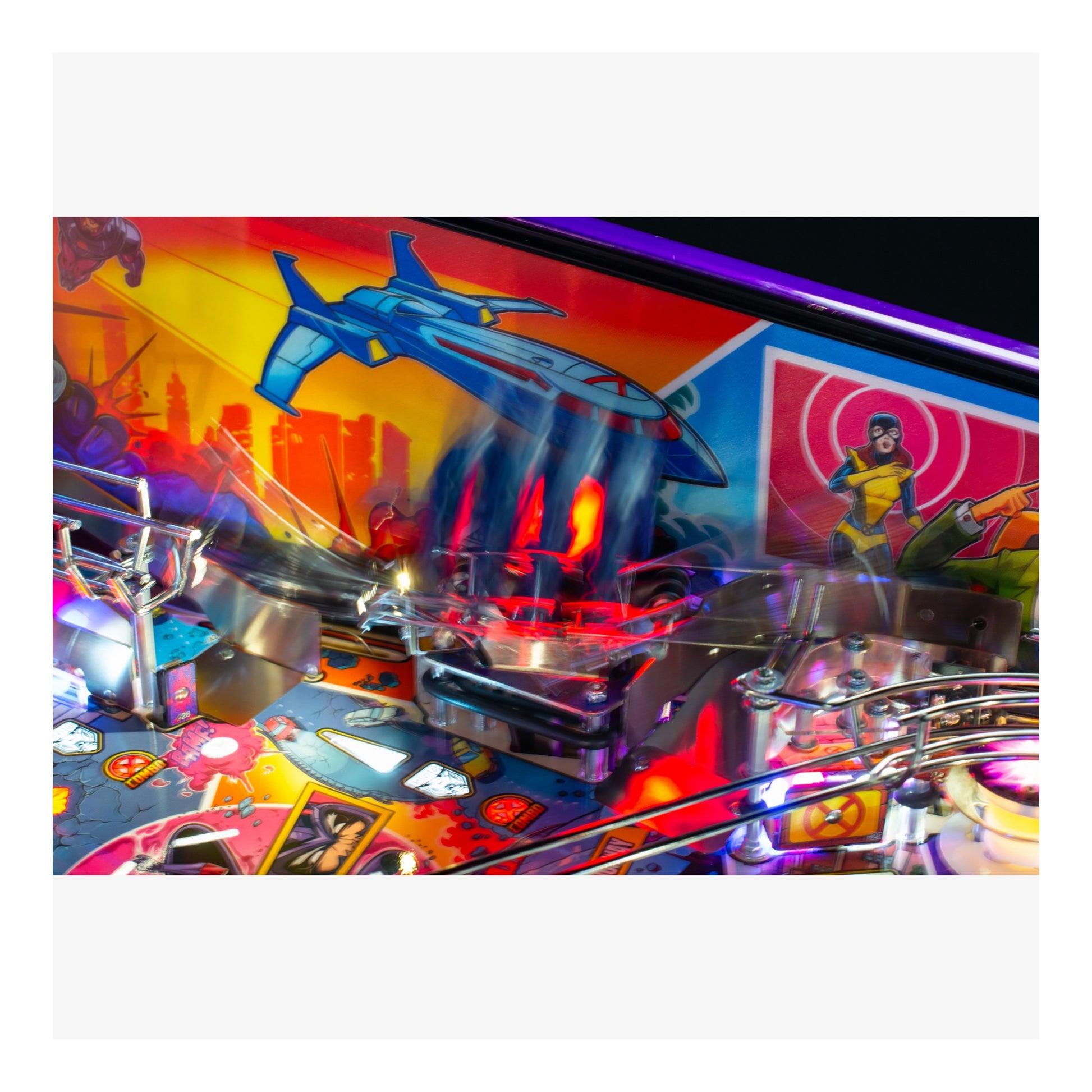 Close-up of a colorful pinball machine with vibrant graphics and lights.