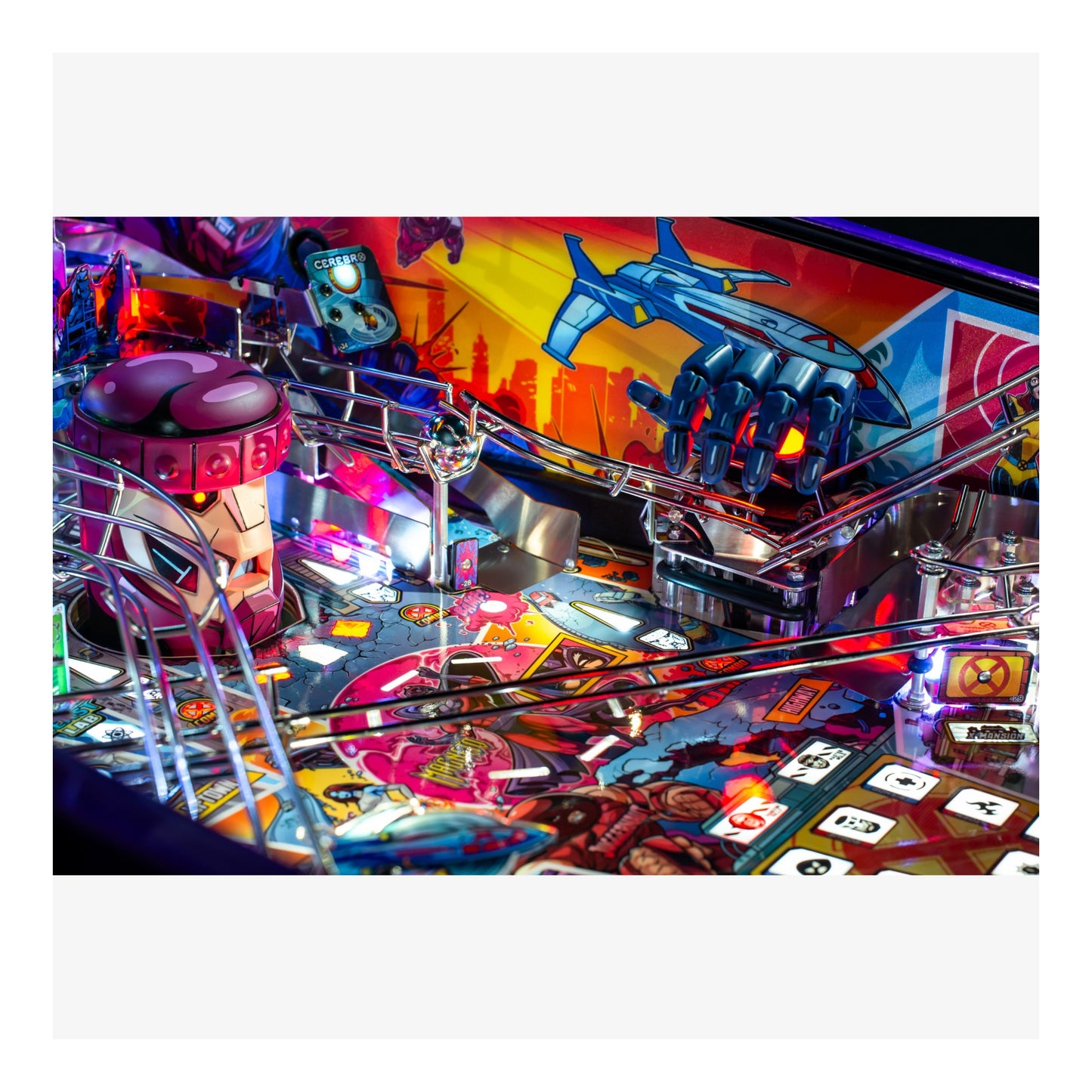 Close-up of a colorful pinball machine with vibrant lights and details.