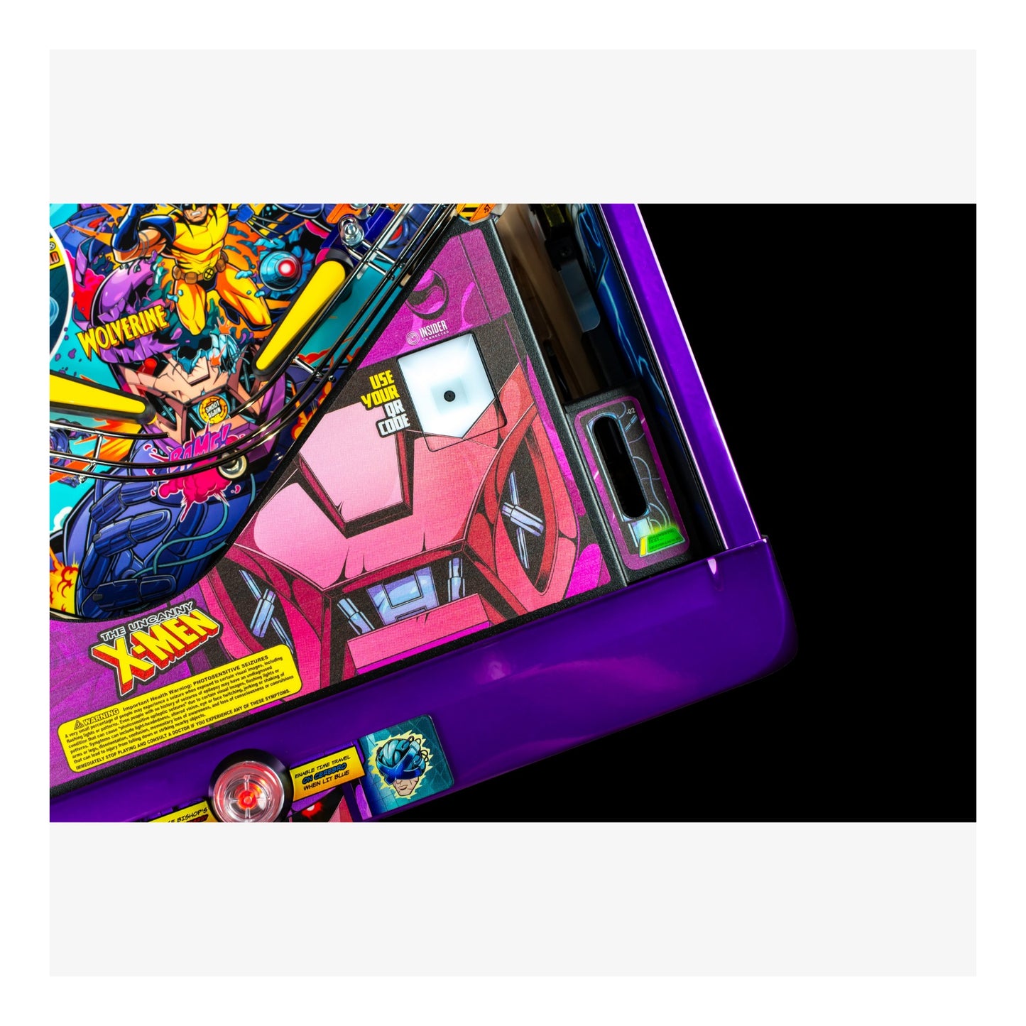 Close-up of a colorful pinball machine with vibrant graphics and text.