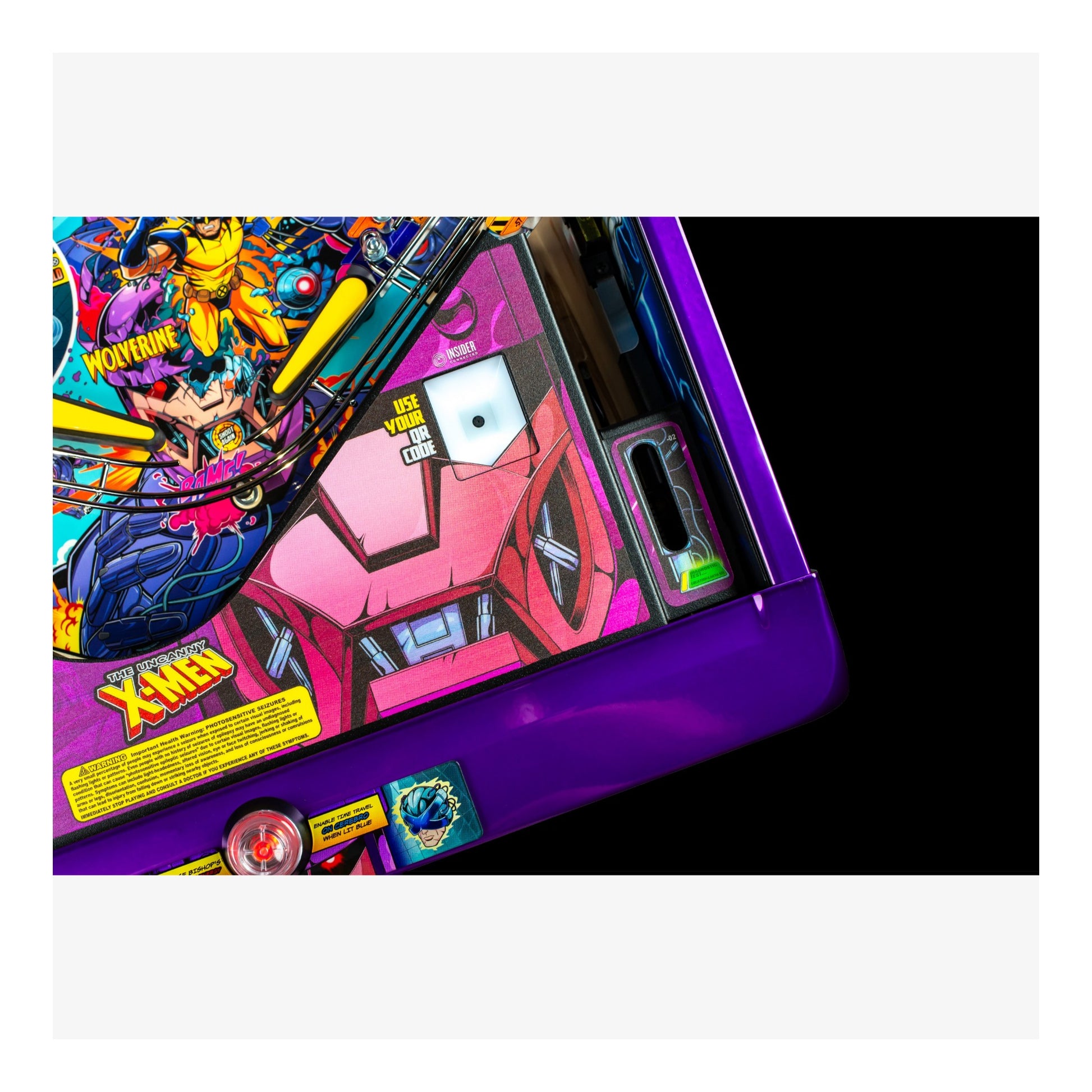 Close-up of a colorful pinball machine with vibrant graphics and text.