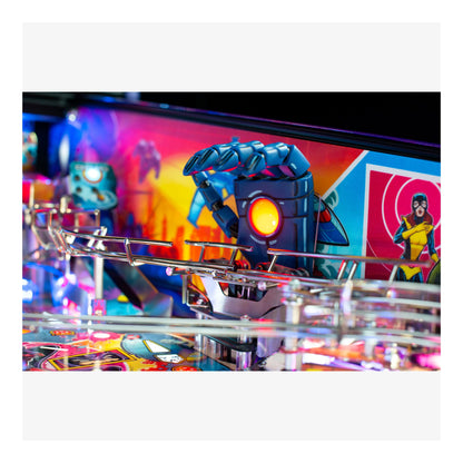 Close-up of a pinball machine with colorful artwork and robot figure.