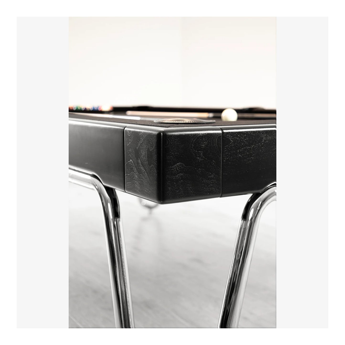 Close-up of a black and silver electronic device on a white background